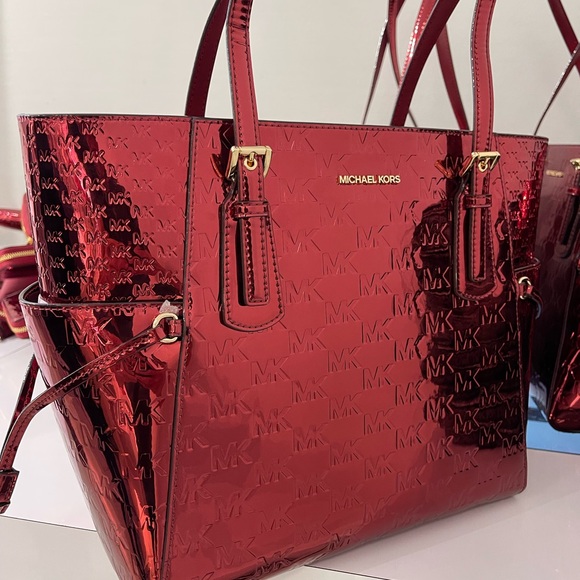 MICHAEL KORS Voyager Lg Metallic Logo Debossed EW Shoulder Tote Bag
Cherry 
NWT - Picture 7 of 16